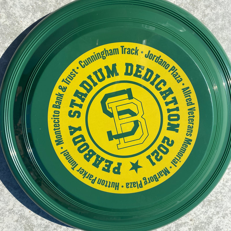 Green frisbee with yellow SBHS logo